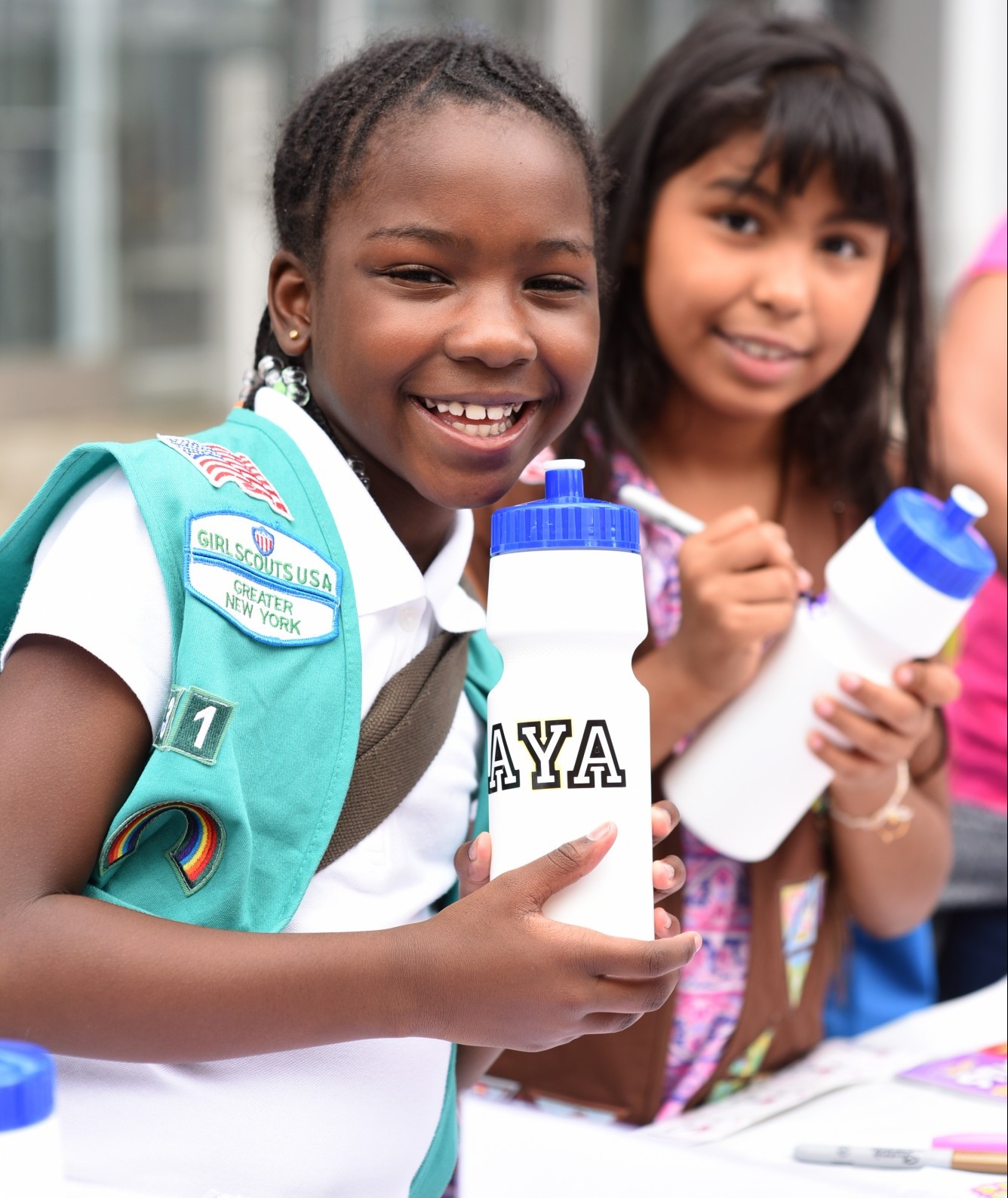 Two children hold their reusable water bottles during Manhattanville's Community Day on September 28th.