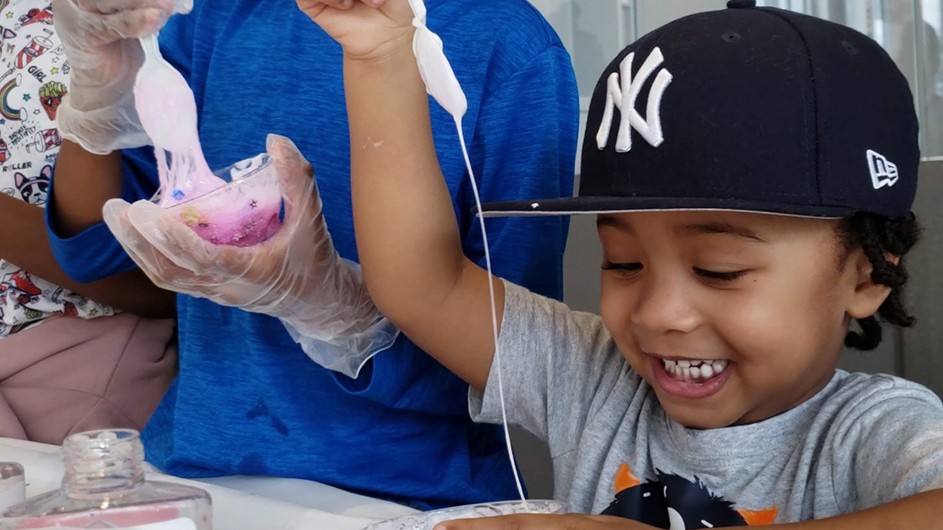 Children make slime at during a Manhattanville Community Day "Slime Time" event at the Zuckerman Institute.