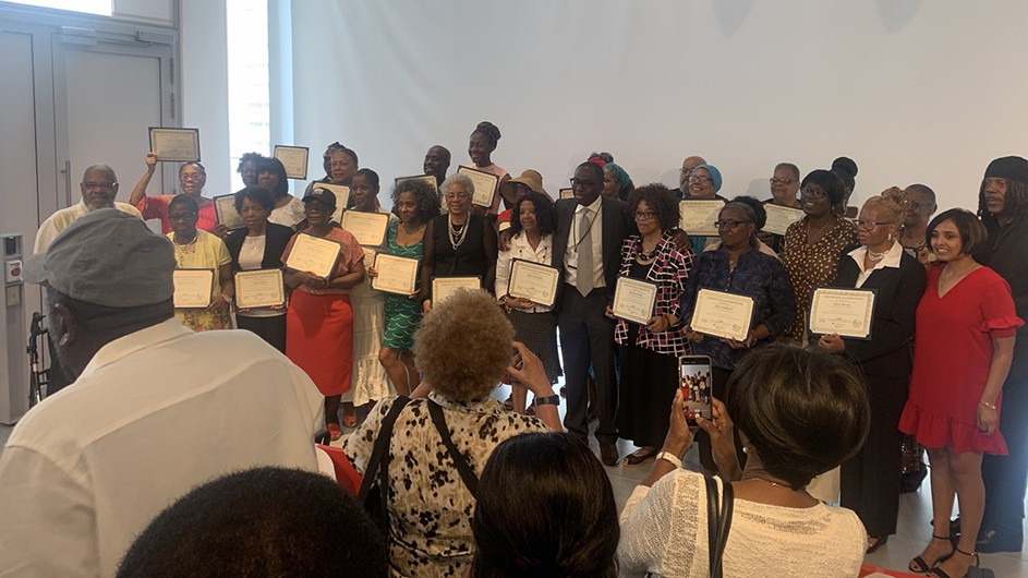 The graduating class of InTOuCH 2019 stand together with their certificates in hand.